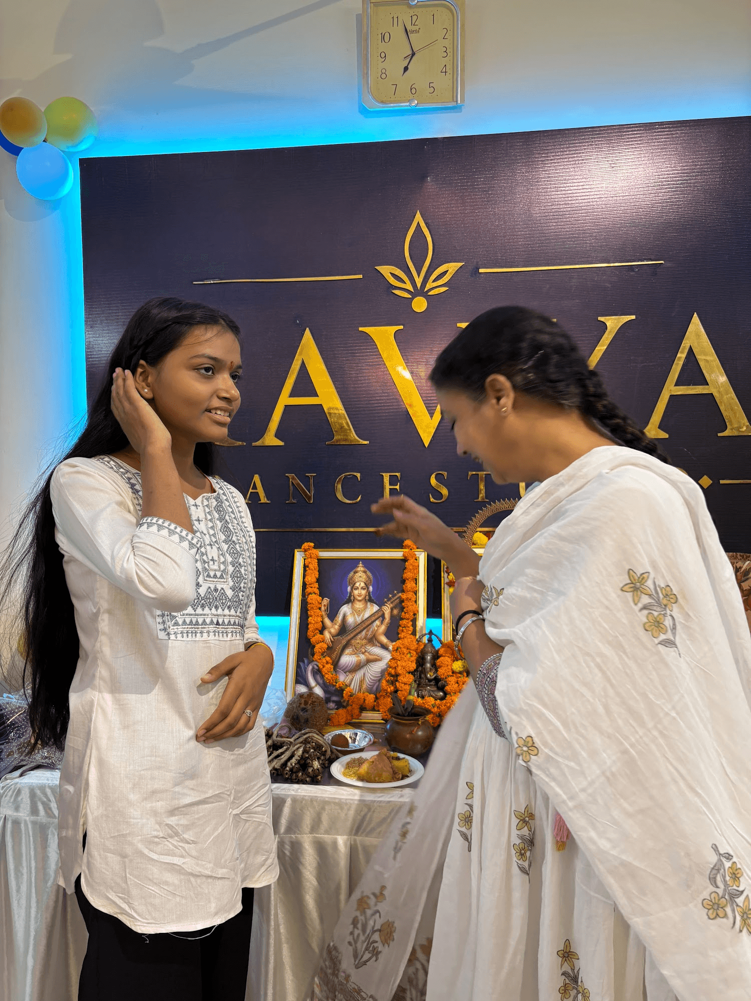 A student receiving a blessing at the studio